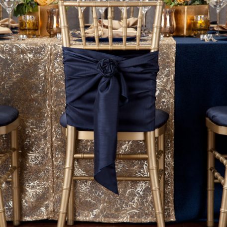 Blue Cotier Table Linen with Golden Helena Table Runner, Goldmine Matte Satin Napkins and Blue Lino Limoges Glass Chargers