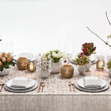 Bronze Jacks Table Linen featuring a Silver Alkaline Dinner Napkin on top of our Clear frost with Silver Rim Glass Charger