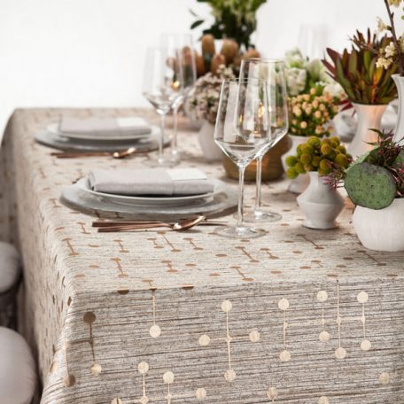 Bronze Jacks Table Linen featuring a Silver Alkaline Dinner Napkin on top of our Clear frost with Silver Rim Glass Charger