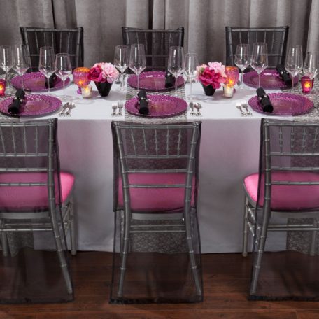 Charcoal Charmed Table Linen with our Luxe Fuchsia Glass Charger and Black Shantung Napkin