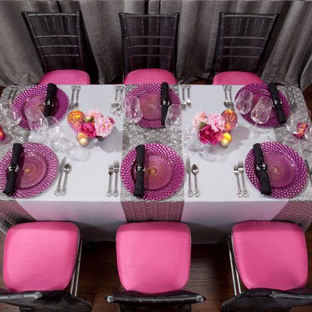 Charcoal Charmed Table Linen with our Luxe Fuchsia Glass Charger and Black Shantung Napkin