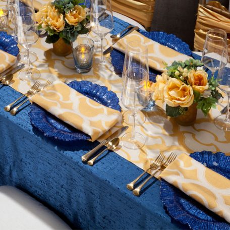 Daffodil Miramar Table Runner and Napkins show over Lapis Contour Table Linen