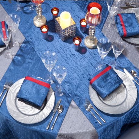 Gunmetal Contour Table Linen with Lapis Contour Table Runners and Napkins on top of our Silver Tidal Wave Charger.