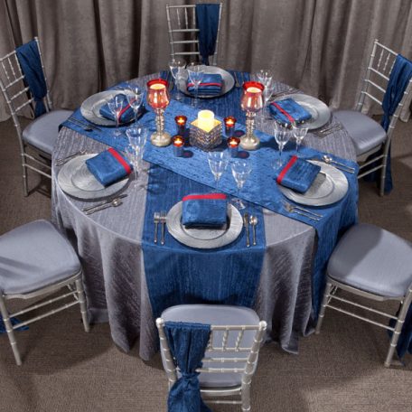 Gunmetal Contour Table Linen with Lapis Contour Table Runners and Napkins on top of our Silver Tidal Wave Charger.