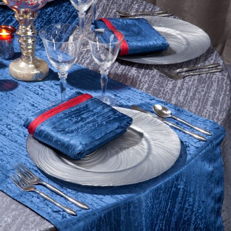 Gunmetal Contour Table Linen with Lapis Contour Table Runners and Napkins on top of our Silver Tidal Wave Charger.