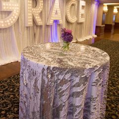 Our Silver Mermaid sequin table linen is the perfect rental for any event. Shown here on hi-top tables. Get stress free rentals from Fabulous Events.