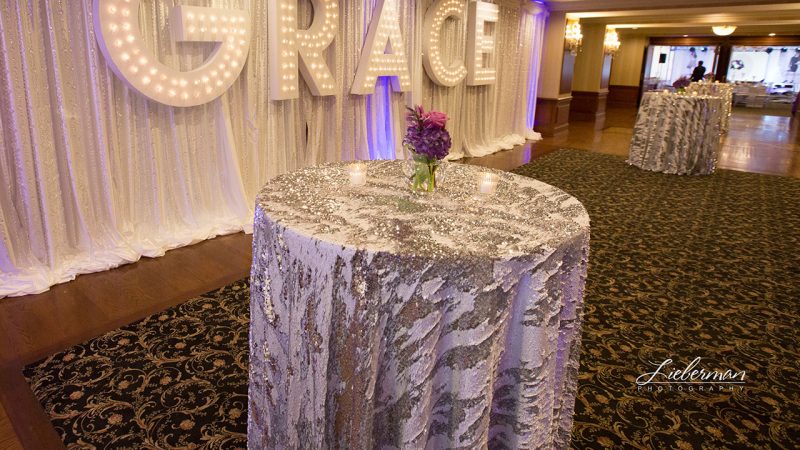 Our Silver Mermaid sequin table linen is the perfect rental for any event. Shown here on hi-top tables. Get stress free rentals from Fabulous Events.