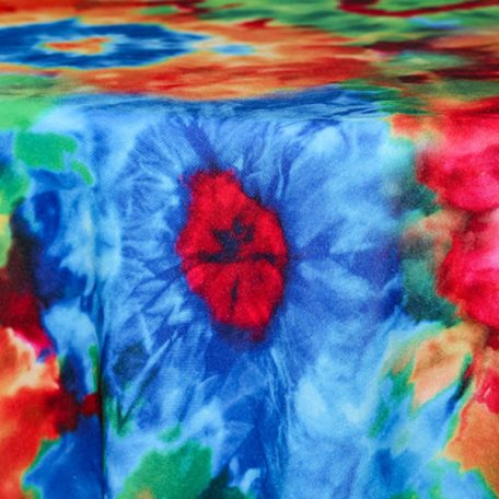 Rent our Tie Dye retro table linen for parties and events.